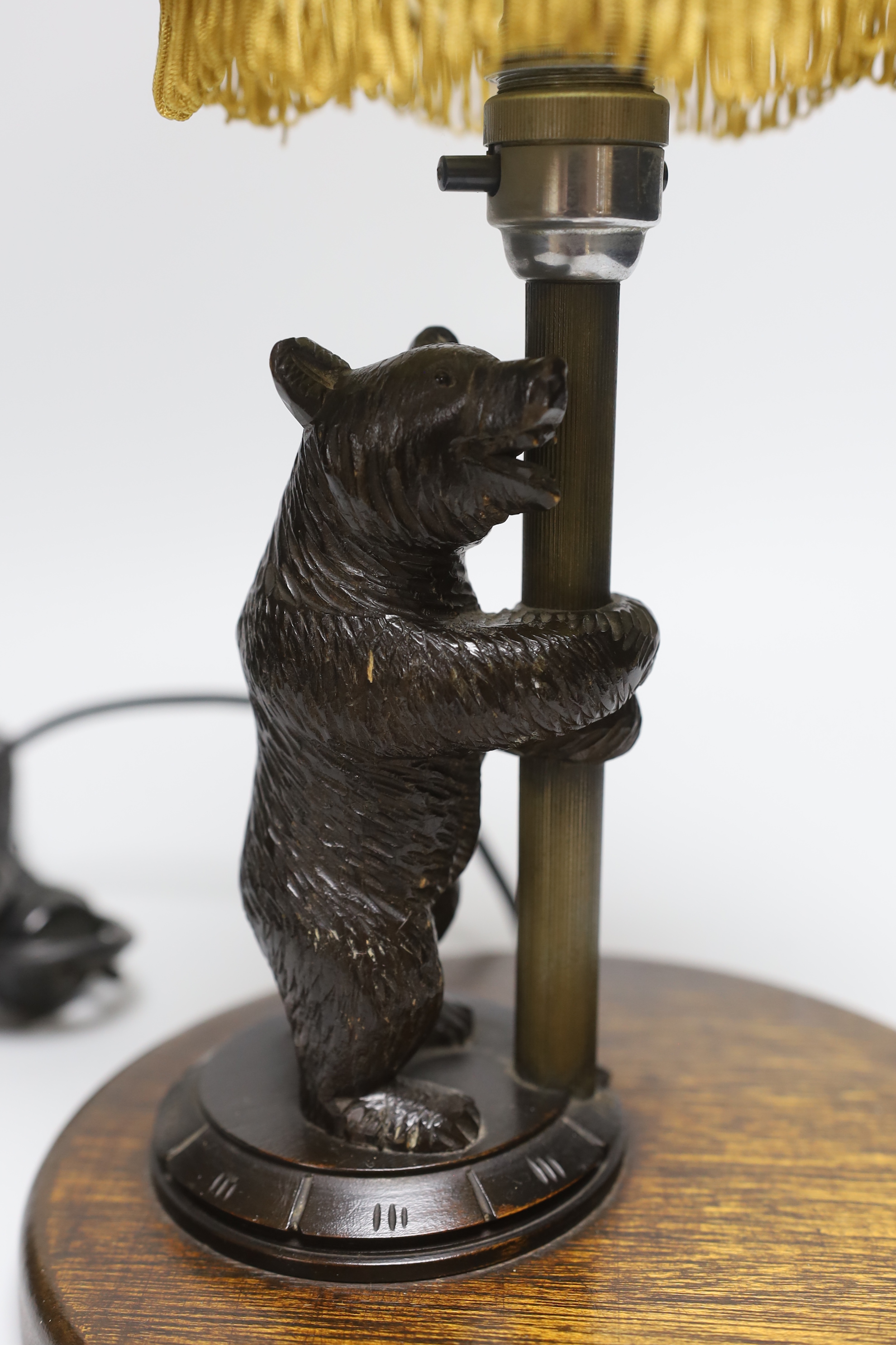 A Black Forest 'bear' table lamp, 36cm including shade